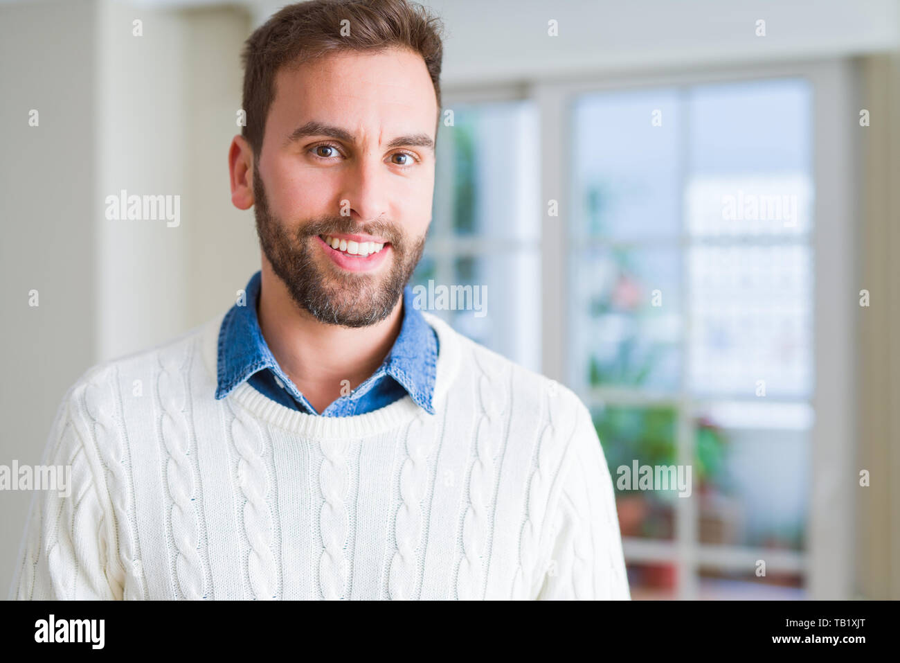 Handsome man smiling positive at the camera Stock Photo - Alamy