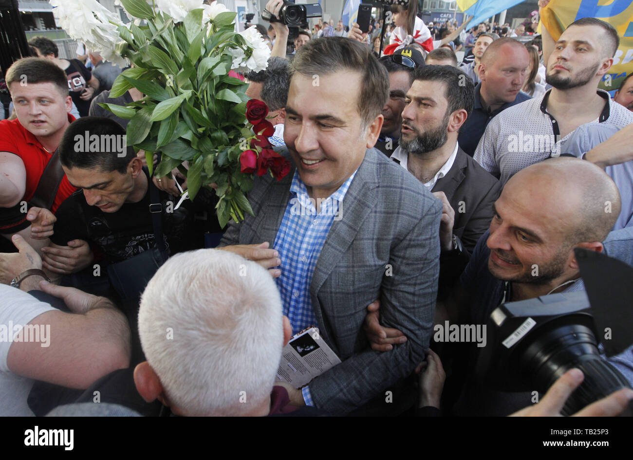 May 29, 2019 - Kiev, Ukraine - Former Georgian president and ex-Odessa Governor MIKHEIL SAAKASHVILI (C) walks as he arrives to the Boryspil international airport near Kiev, Ukraine, on 29 May 2019. Saakashvili returned to Ukraine after Ukrainian President Volodymyr Zelensky has reinstated Mikheil Saakashvili's Ukrainian citizenship on 28 May 2019. Zelensky deleted the respective provision from his predecessor Petro Poroshenko's No. 196 order dated July 26, 2017, the UNIAN inform agency reported. Ukrainian opposition leader Mikheil Saakashvili was deported to Poland on 12 February 2018, the Ukr Stock Photo