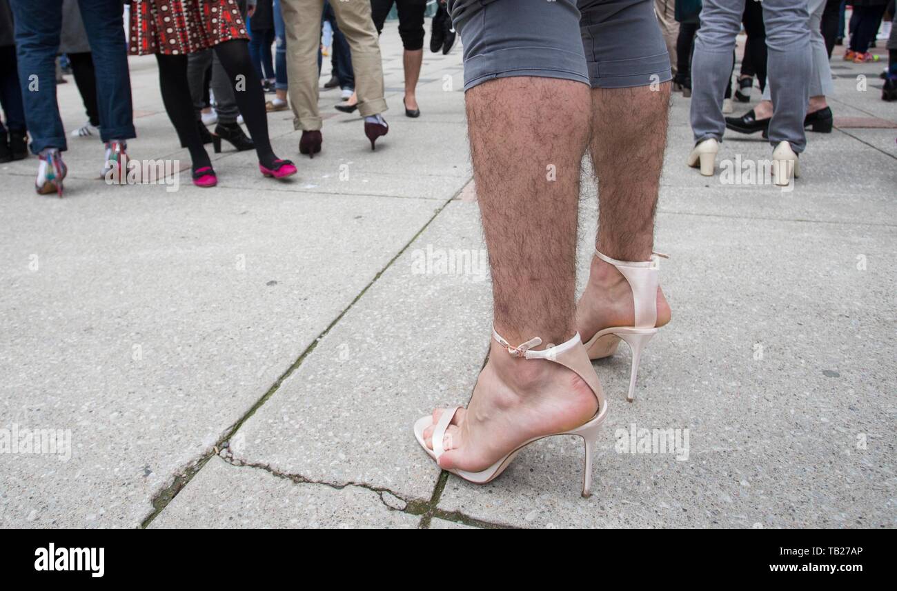 Toronto, Canada. 29th May, 2019. A man wearing high-heel shoes takes part  in the 2019 Walk a Mile in Her Shoes event in Toronto, Canada, May 29,  2019. More than 500 participants