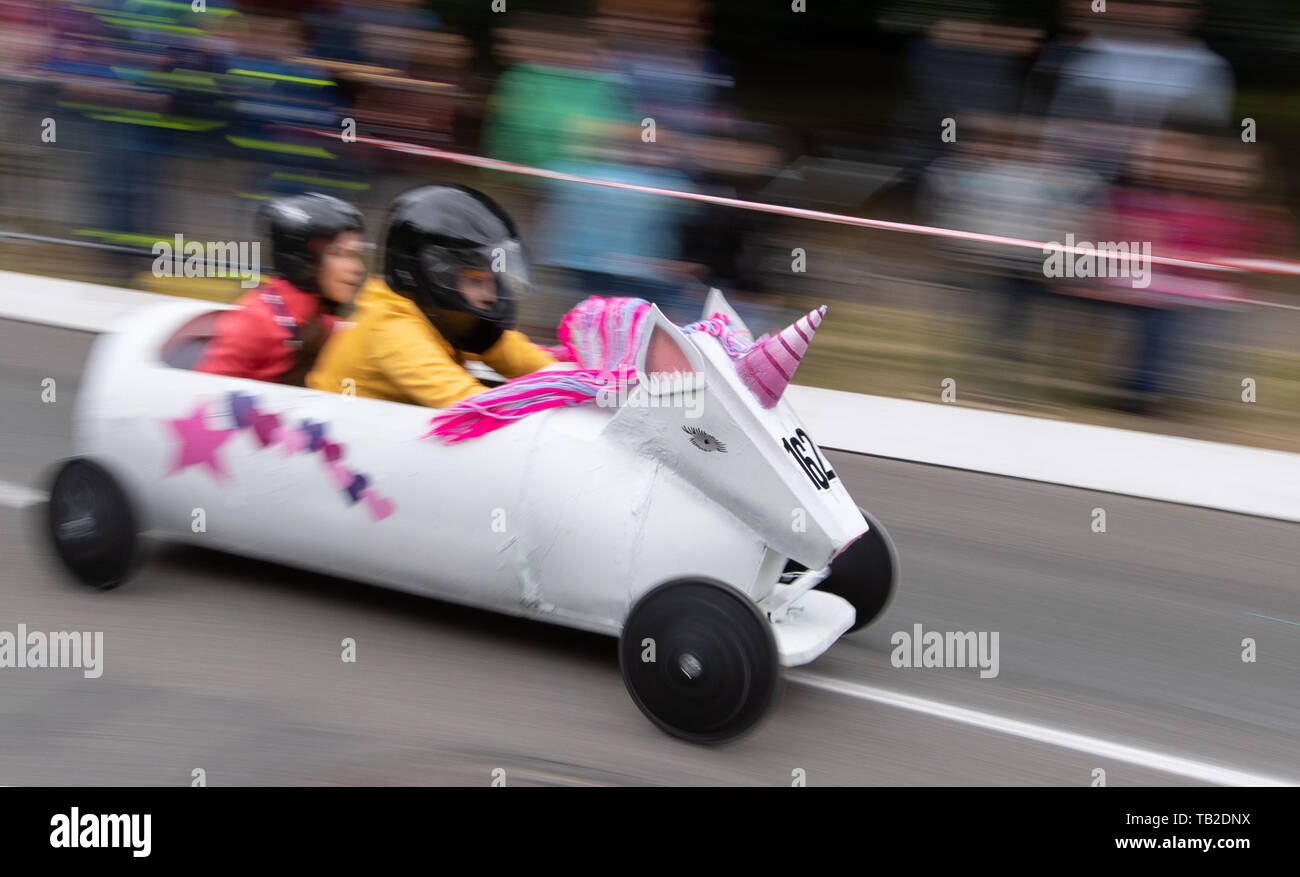 Osnabrück, Lower Saxony, Germany A soapbox in the shape of a unicorn drives on a road during a soapbox race