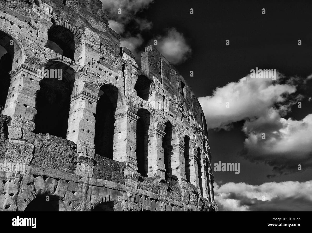 Coliseum inner ring monumental arcades with clouds in Rome (Black and White) Stock Photo