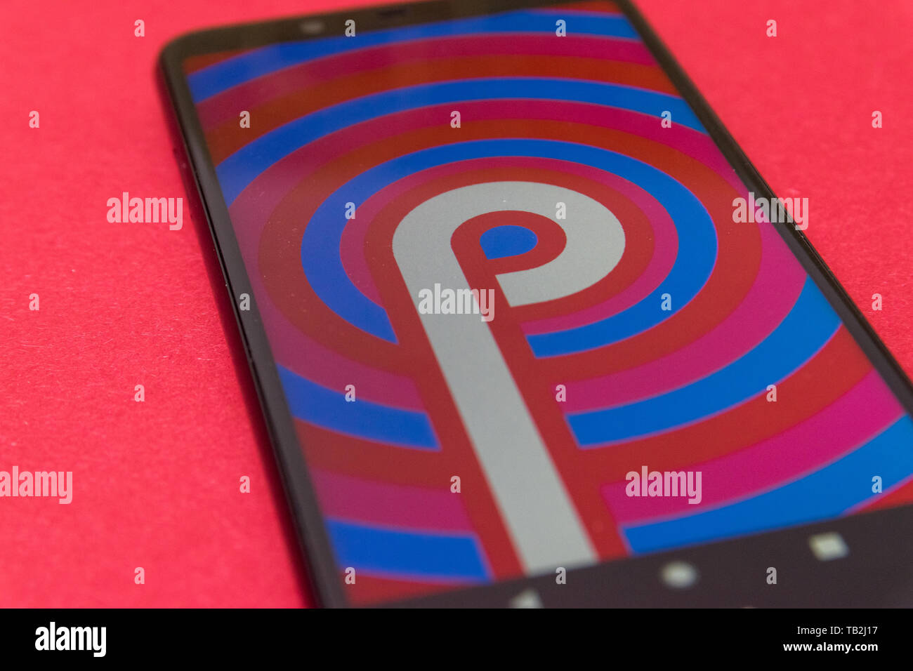 Cluj, Romania - May 13, 2019: Android Pie logo on a phone screen. It is the ninth major release and the 16th version of the Android mobile operating s Stock Photo