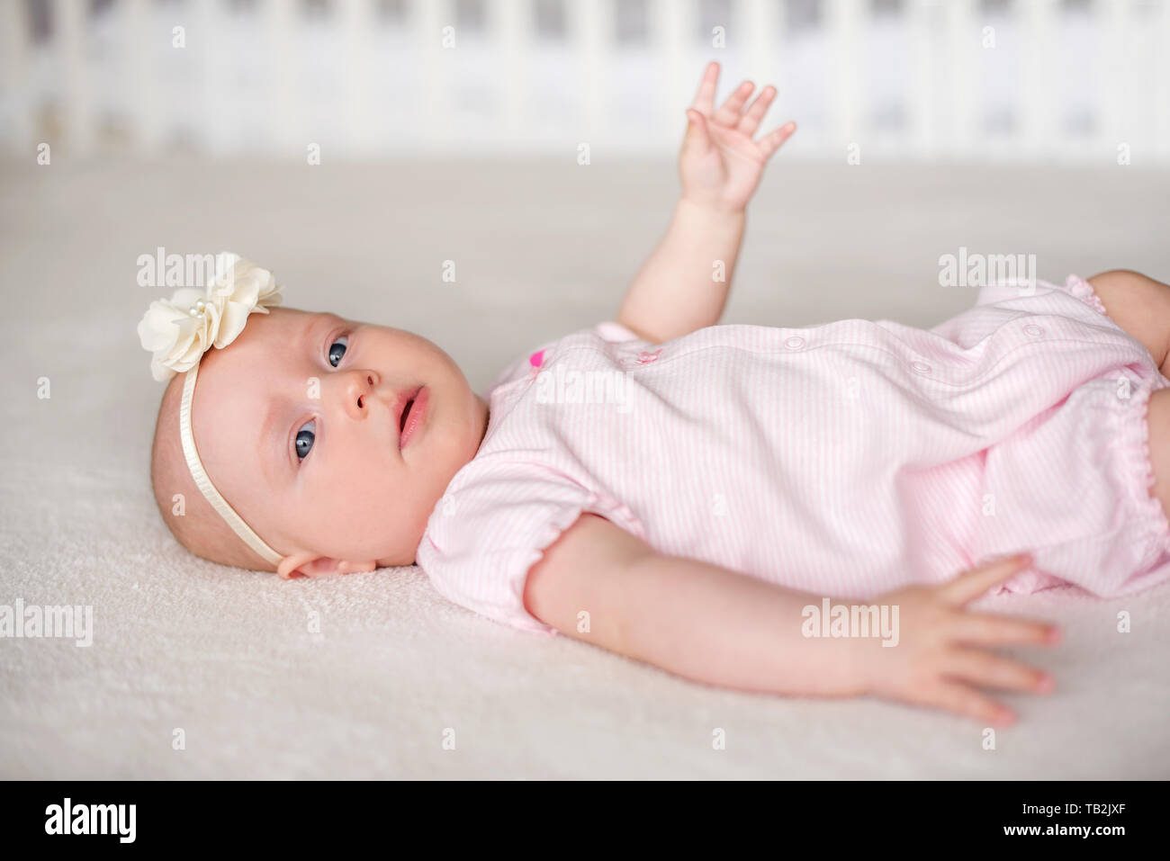 Portrait of pretty baby girl with blue eyes Stock Photo - Alamy