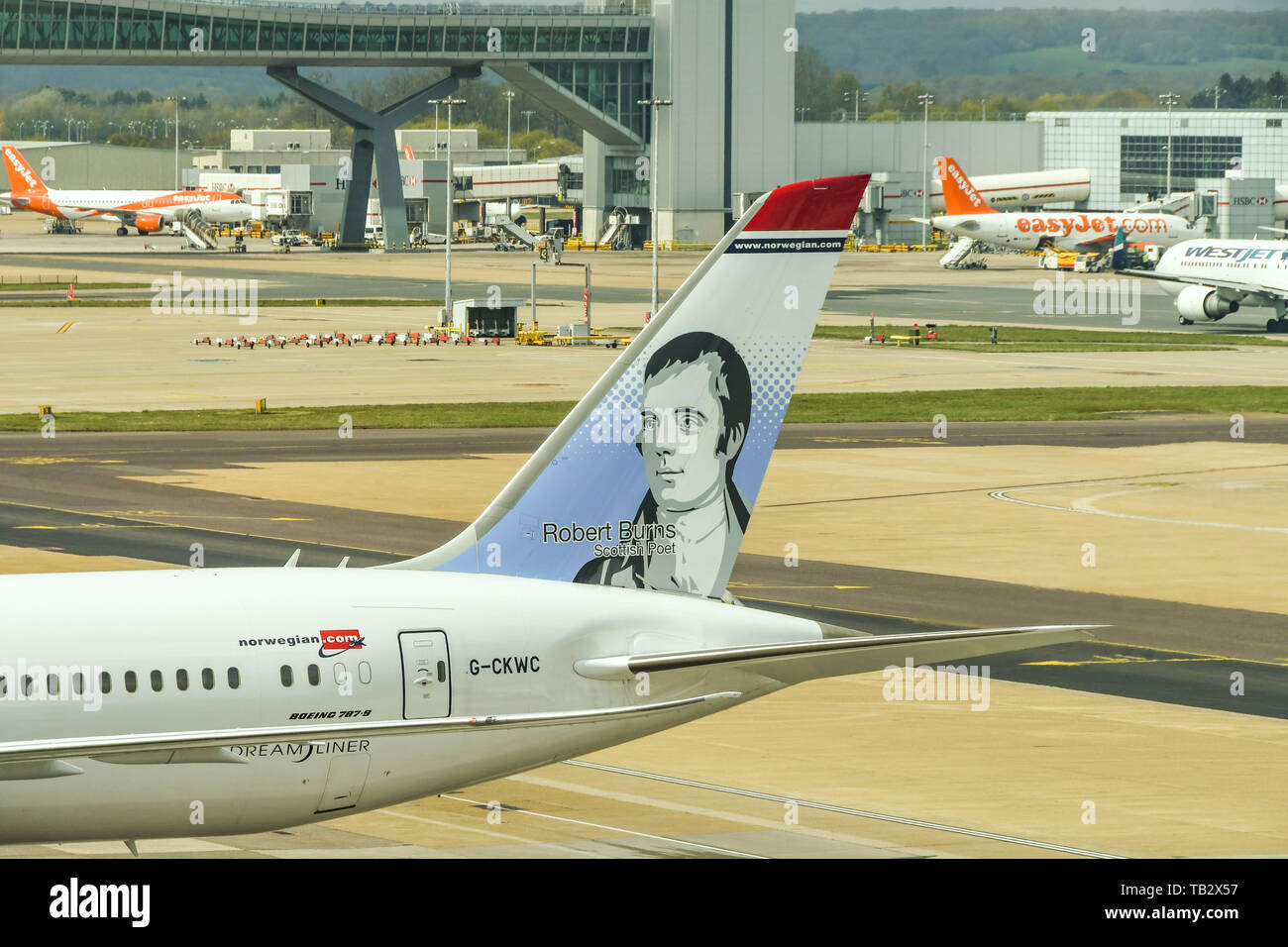 LONDON GATWICK AIRPORT, ENGLAND - APRIL 2019: Artwork on the tail of a plane operated by low cost carrier Norwegian Air at London Gatwick Airport. . Stock Photo