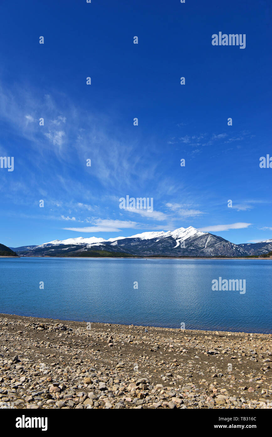 Beautiful high altitude blue alpine lake with snow capped peaks, Rocky ...