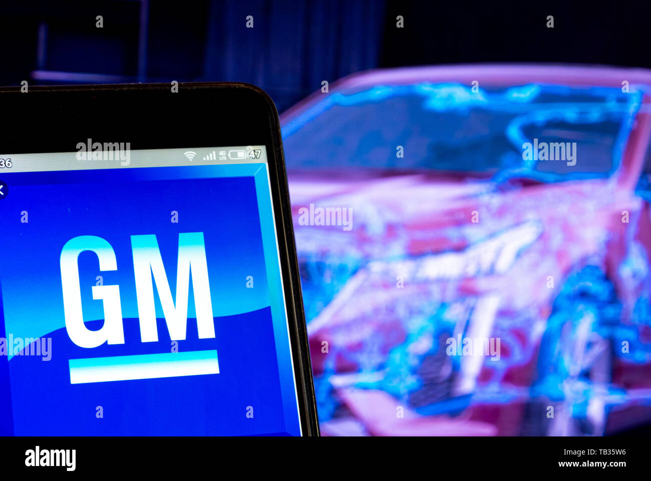 In this photo illustration the General Motors Company logo is seen