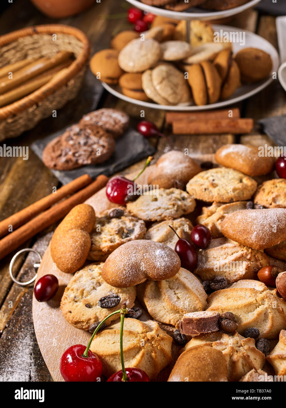 Oatmeal cookies and sand chocolate cake with cherry berry Stock Photo