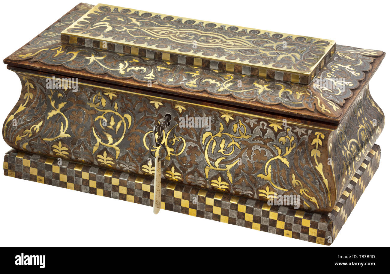 A French casket in Boulle technique, circa 1860, The rectangular casket made from walnut root wood with curving sides. Entirely covered in richly decorated Boulle inlays of brass and pewter. Can be locked, comes with the original iron key. The interior lined in blue velvet. Dimensions 10.5 x 24 x 12.5 cm. handicrafts, handcraft, craft, object, objects, stills, clipping, clippings, cut out, cut-out, cut-outs, historic, historical 19th century, Additional-Rights-Clearance-Info-Not-Available Stock Photo