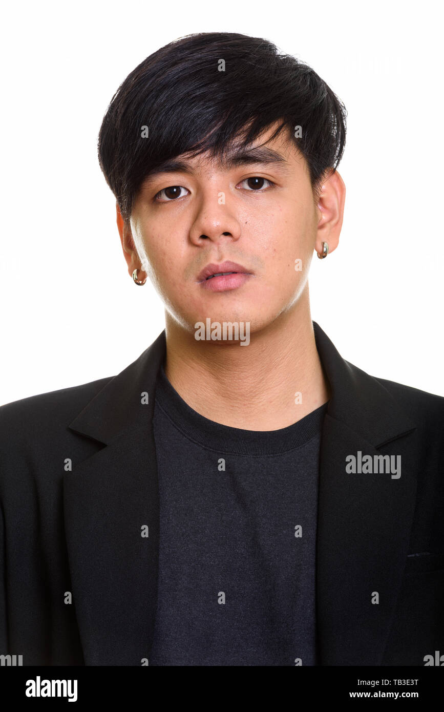 Face of young handsome Asian businessman looking cool Stock Photo