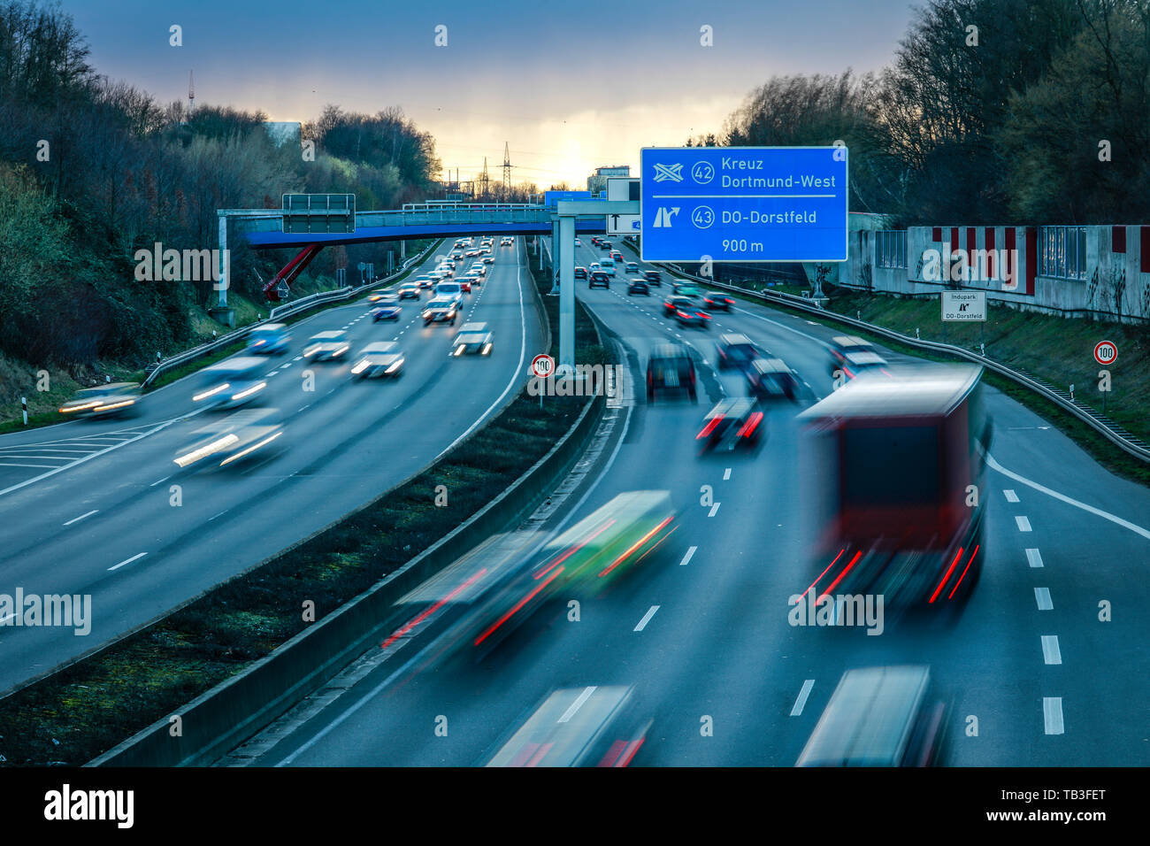 07.03.2019, Dortmund, North Rhine-Westphalia, Germany - Cars in the evening traffic on the Ruhr motorway A40 in the evening twilight at the intersecti Stock Photo