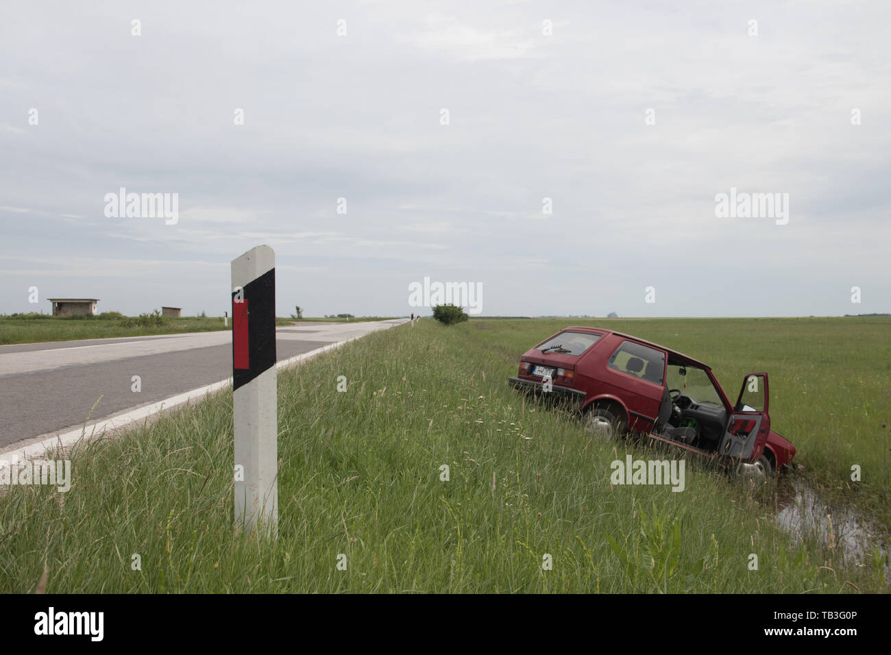 irresponsible driving in bad weather conditions, vehicle went off road in ditch, near Kikinda city Stock Photo