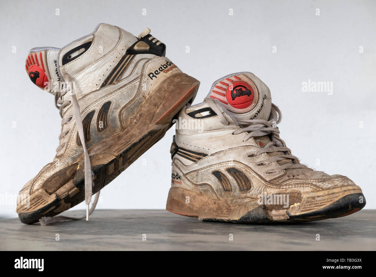 Pair of old worn 1990s Reebok Pump white basketball sneakers Stock Photo -  Alamy