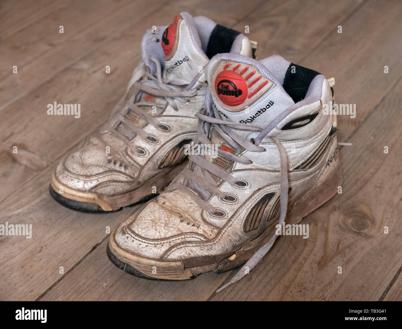Pair of old worn 1990s Reebok Pump white basketball sneakers Stock Photo -  Alamy