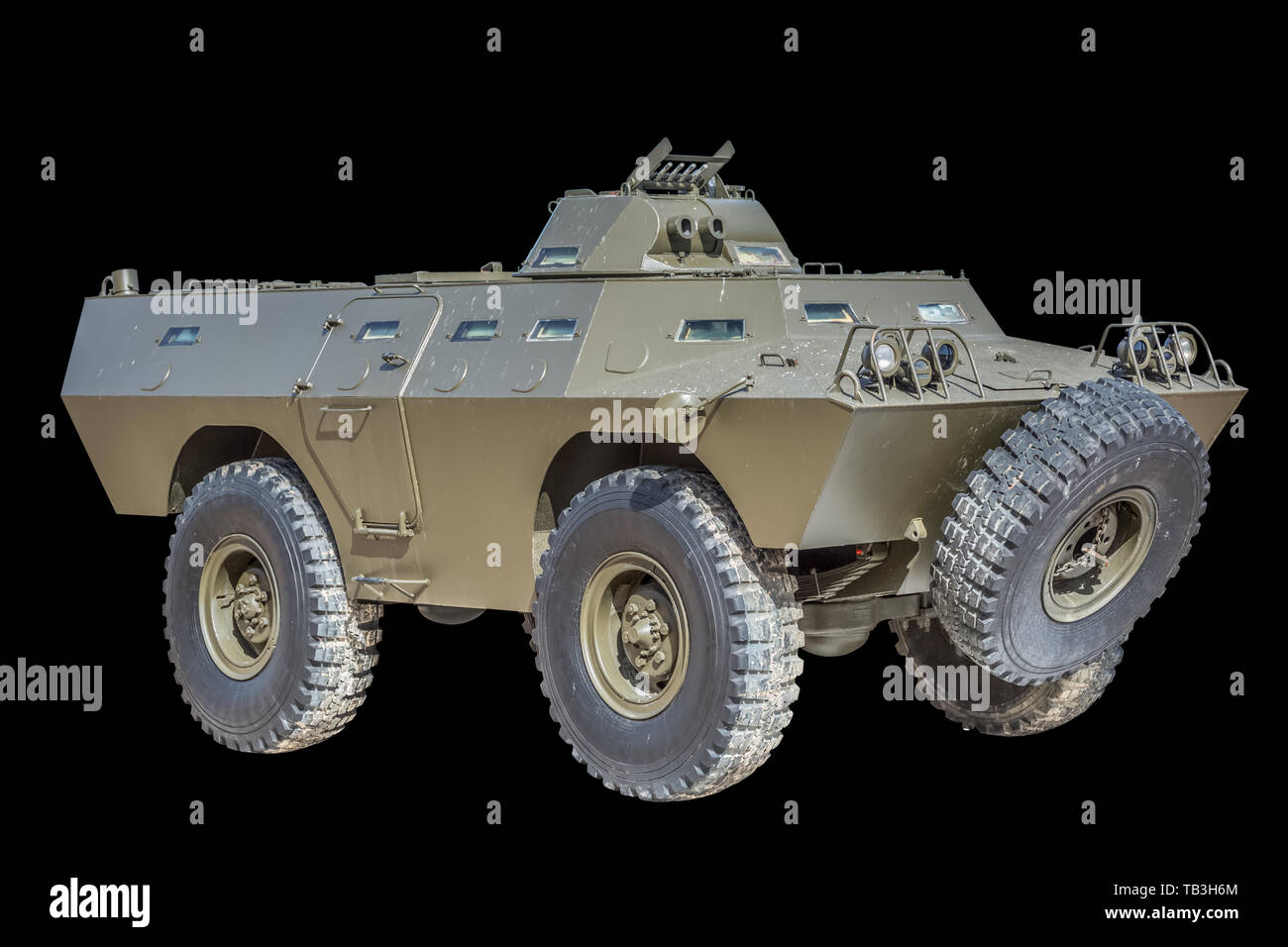 Front view of old armored military vehicle, black background Stock