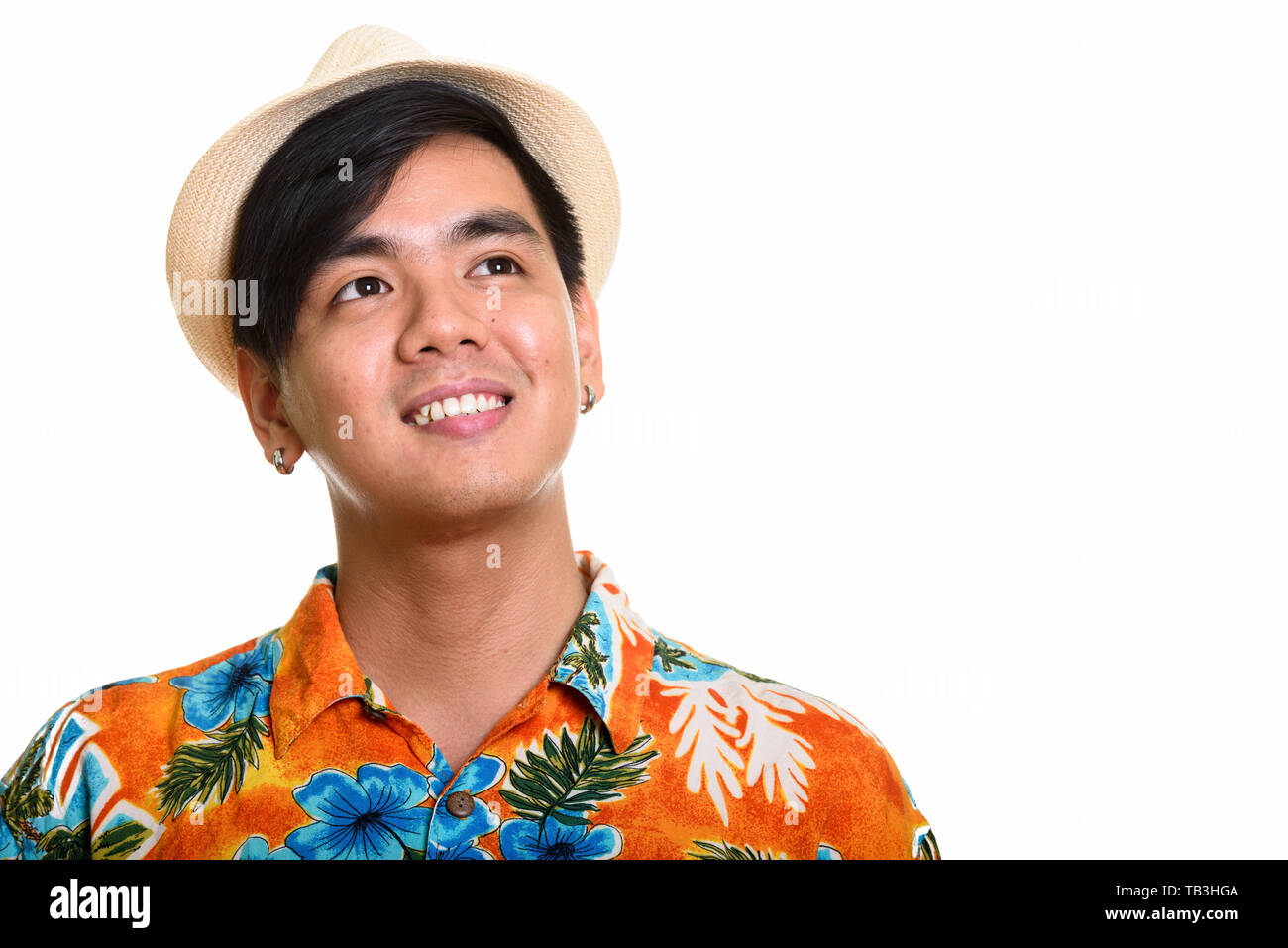 Young happy Asian man smiling while thinking Stock Photo - Alamy