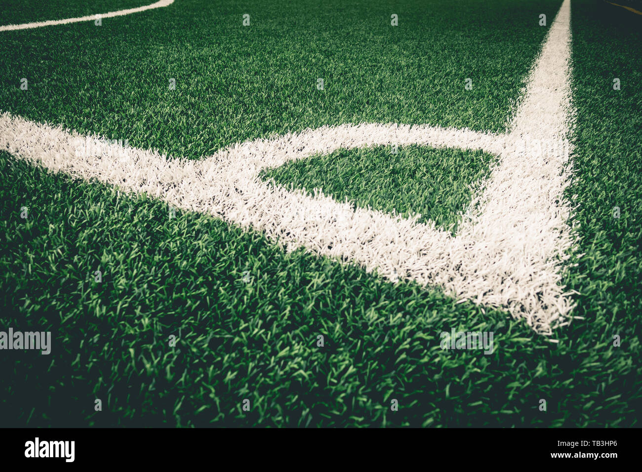 Corner kick white line on artifact grass for soccer training Stock Photo