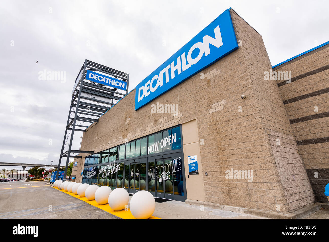 Exterior view of a Decathlon sporting goods store in Granada, Spain; closed  during siesta time; Decathlon is a French company with shops worldwide  Stock Photo - Alamy