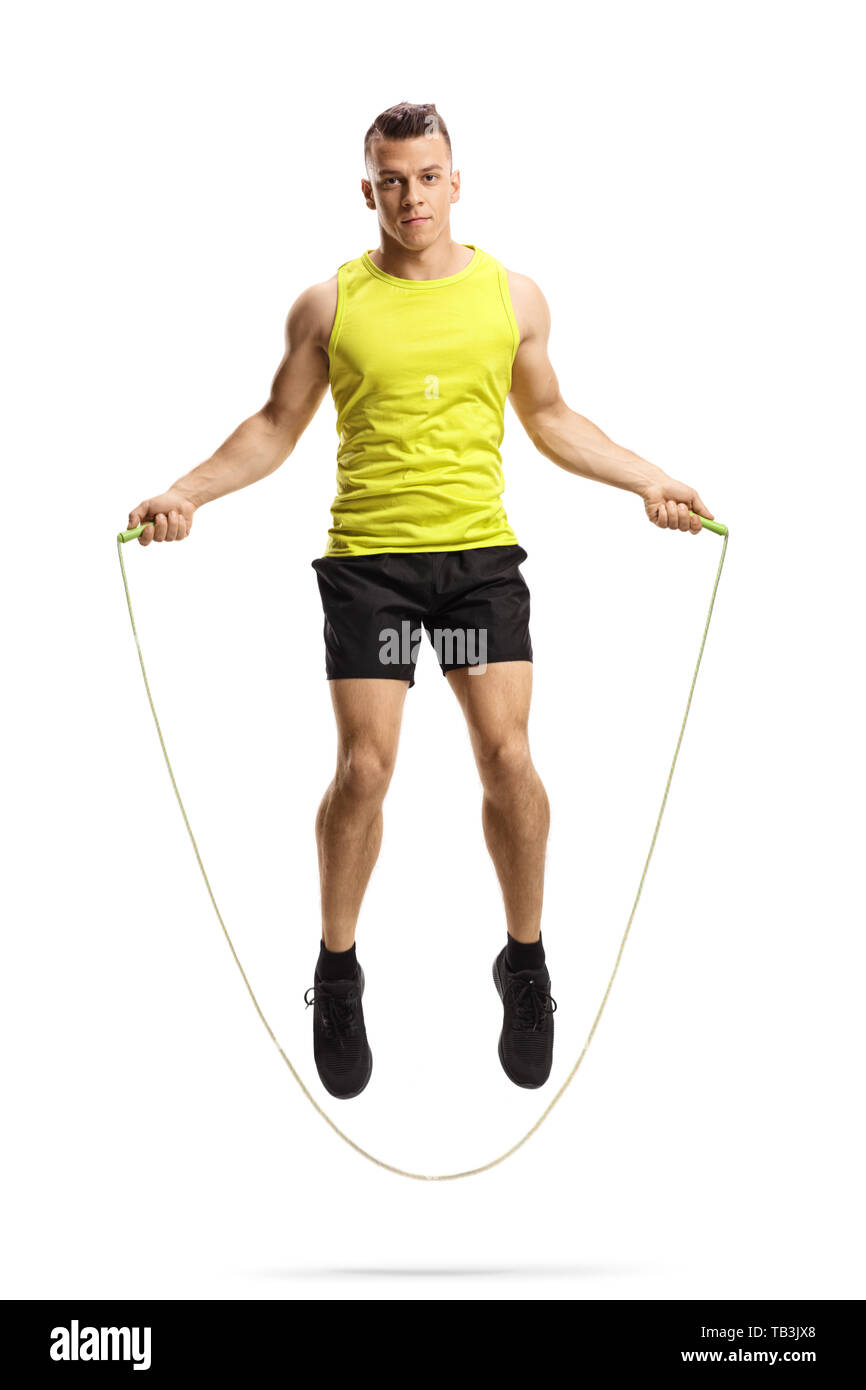 Full length portrait of a young muscular man skipping rope isolated on white background Stock Photo
