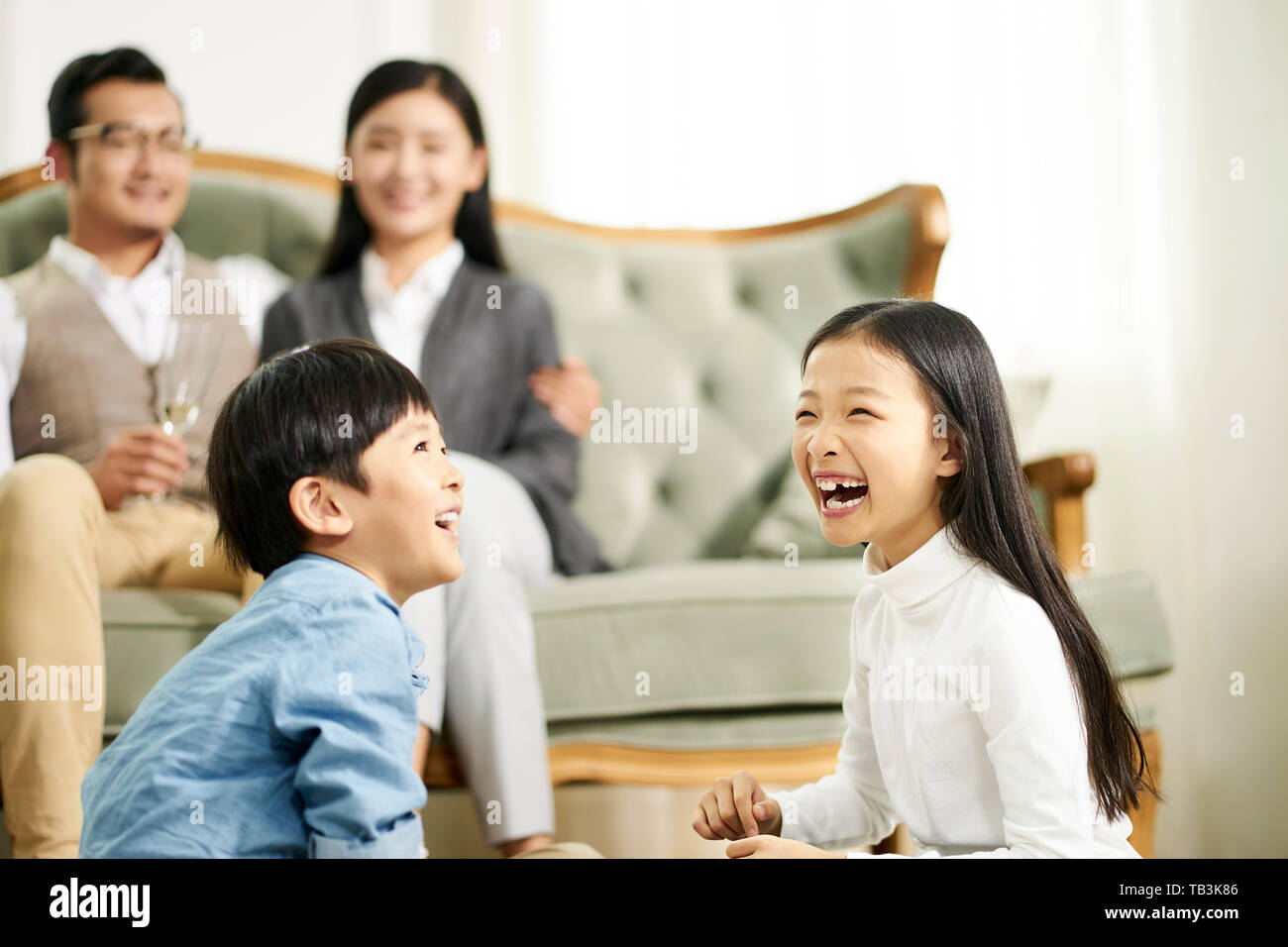 asian family with two children having a good time at home Stock Photo