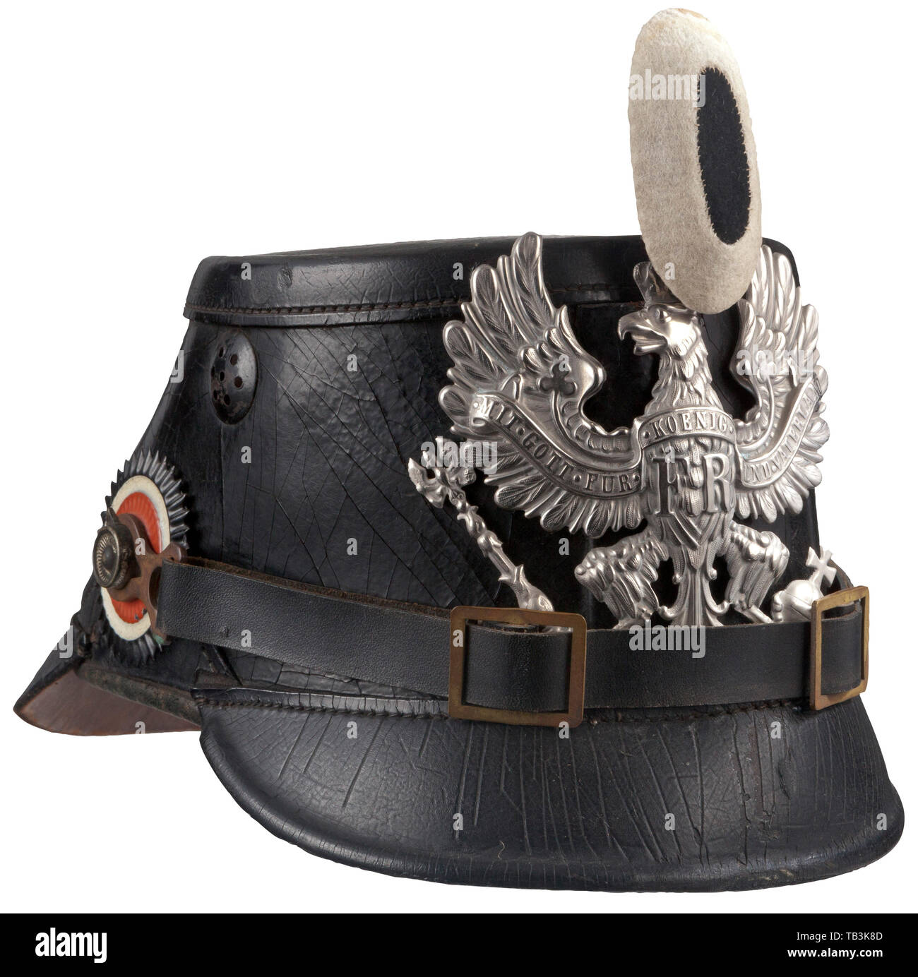 A pre-war shako for enlisted men of the Prussian Telegraph Battalion, Black leather body with front and rear visors showing some crazing, high detail silver Prussian eagle front plate attached by two loops with leather inserts, replacement leather chinstrap with brass buckles attached by M 91 lug side posts, EM national and Prussian state colour cockades, replica black and white Prussian field badge. Interior paper name and manufacturer's tag, 'Gefreiter R. Thomos', 'Festung-Fernsprech Co. No. 3, METZ', black leather liner. USA-lot. Prussian, Pru, Additional-Rights-Clearance-Info-Not-Available Stock Photo