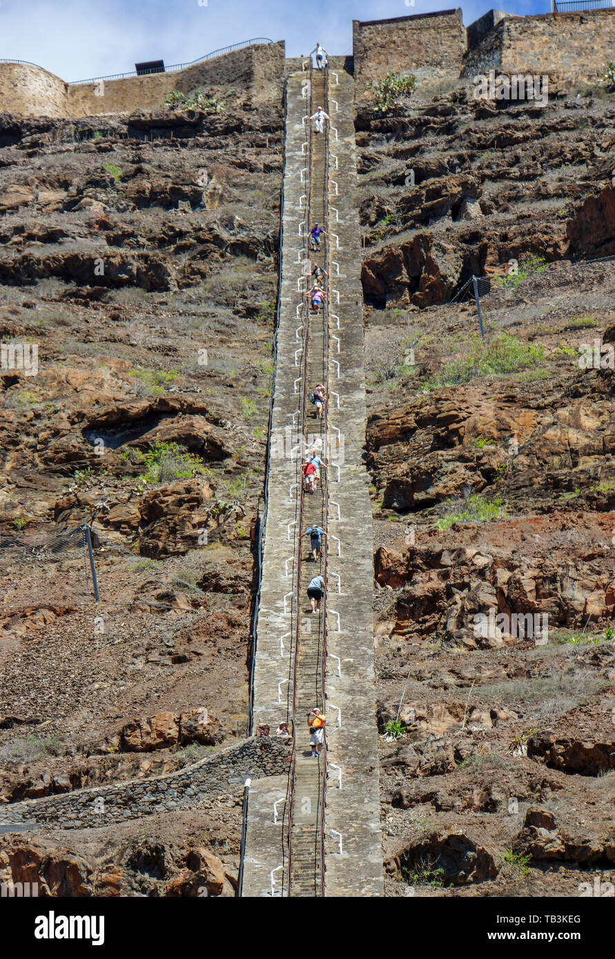 Tourists climbing the 699 steps of Jacob's Ladder, a Grade I-listed staircase leading from Jamestown, Saint Helena, up the side of Ladder Hill Stock Photo