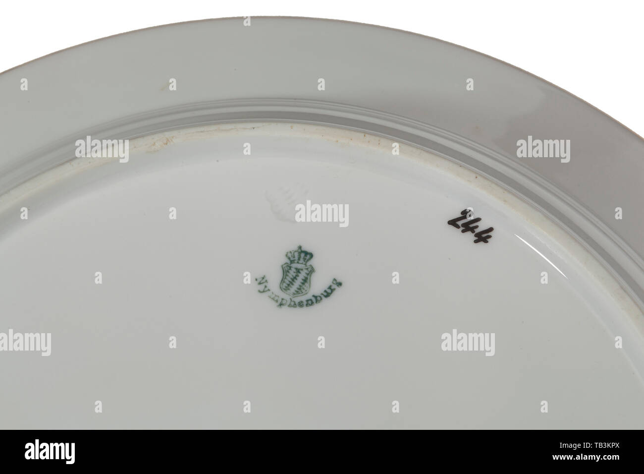 Three of Deutsche Reichsbahn China plates from Göring's dining car, Top edge of each plate has the German national eagle flanked by the letters 'DR,' standing for Deutsche Reichsbahn (tr. German Railway). The underside of the plates are marked for the Nymphenburg Porcelain Manufactory, located within the palace complex of Nymphenburg Palace in Munich, the capital of the state of Bavaria, Germany. In addition to this logo, the number 244 appears in black numerals, representing the last three digits of one of Göring's dining cars, that is number 10244. These plates were taken, Editorial-Use-Only Stock Photo