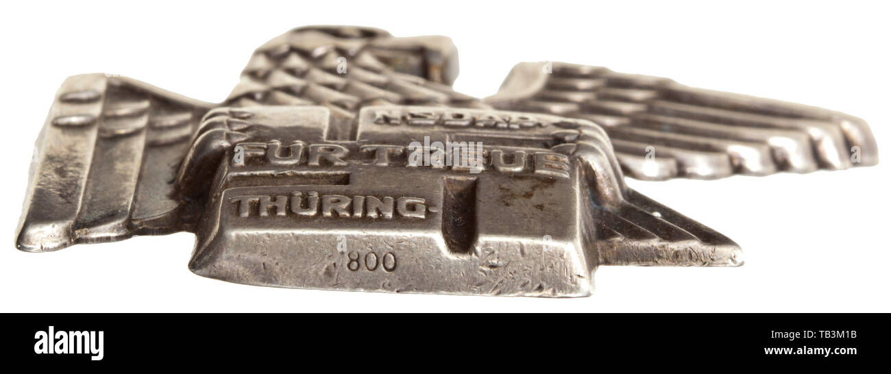 A Thuringia Gau Badge of Honour, Embossed in silver, the lower edge with mark of fineness '800'. The reverse with complete attachment pin system. Width 50 mm. Weight 12.8 g. 20th century, 1930s, 1940s, awards, award, German Reich, Third Reich, Nazi era, National Socialism, object, objects, stills, medal, decoration, medals, decorations, clipping, cut out, cut-out, cut-outs, honor, honour, National Socialist, Nazi, Nazi period, historic, historical, Editorial-Use-Only Stock Photo