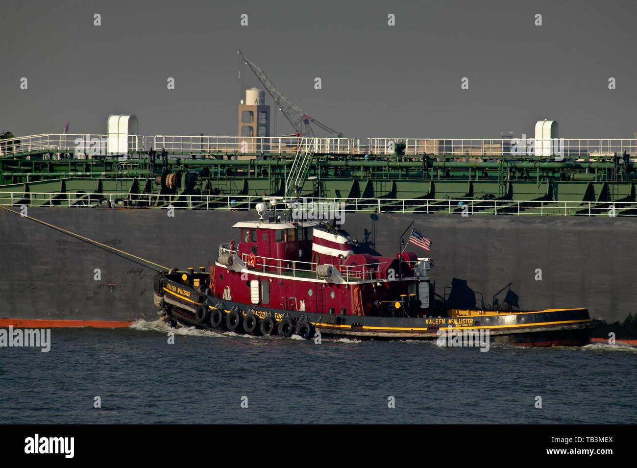 Tug boat on the Hudson River towing ship into the harbor at New York NY