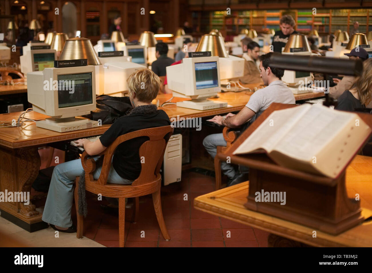 People access the Internet on computers in the main reading room at the ...