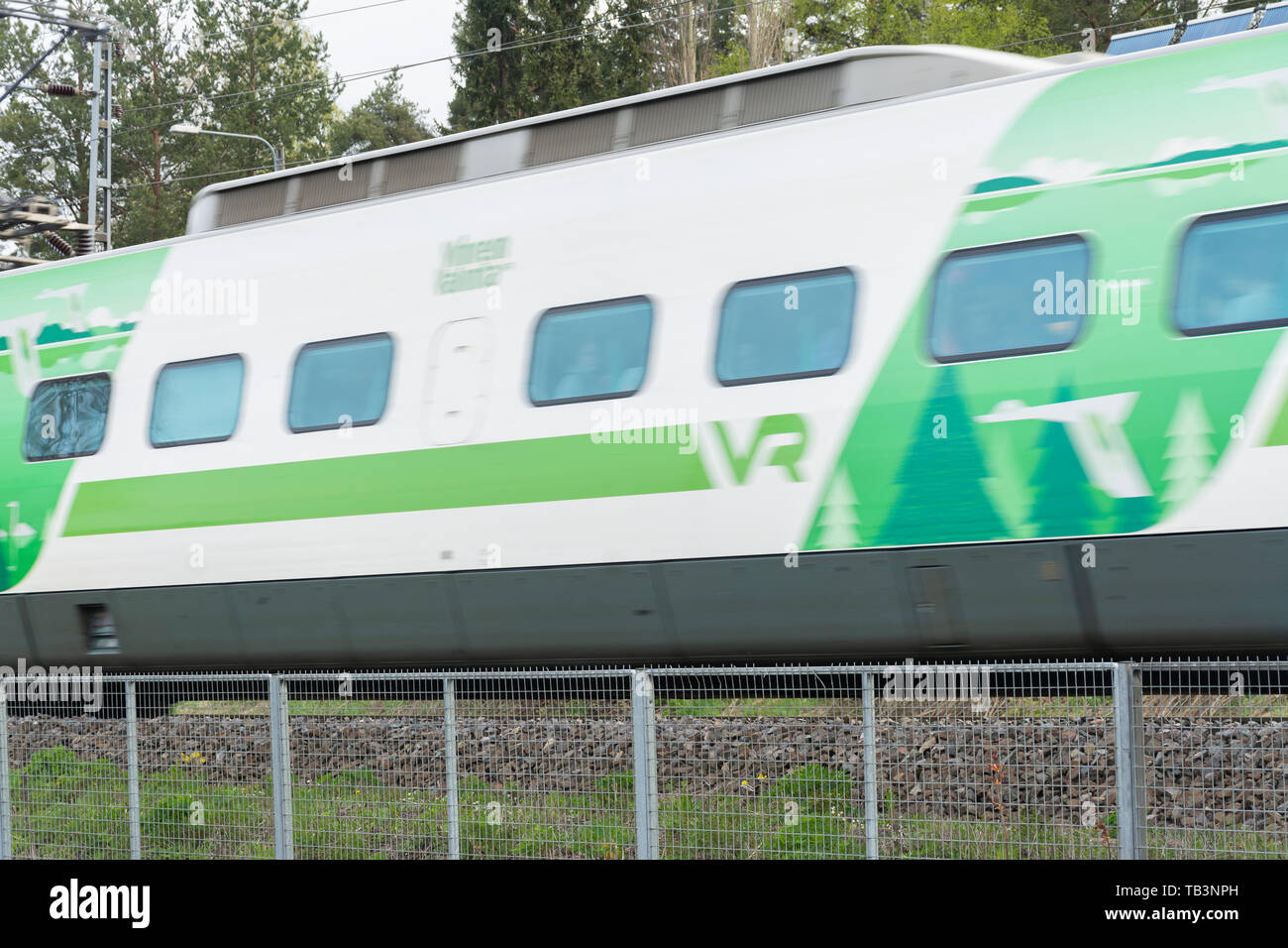 Train in full speed passing Hämeenlinna Finland Stock Photo