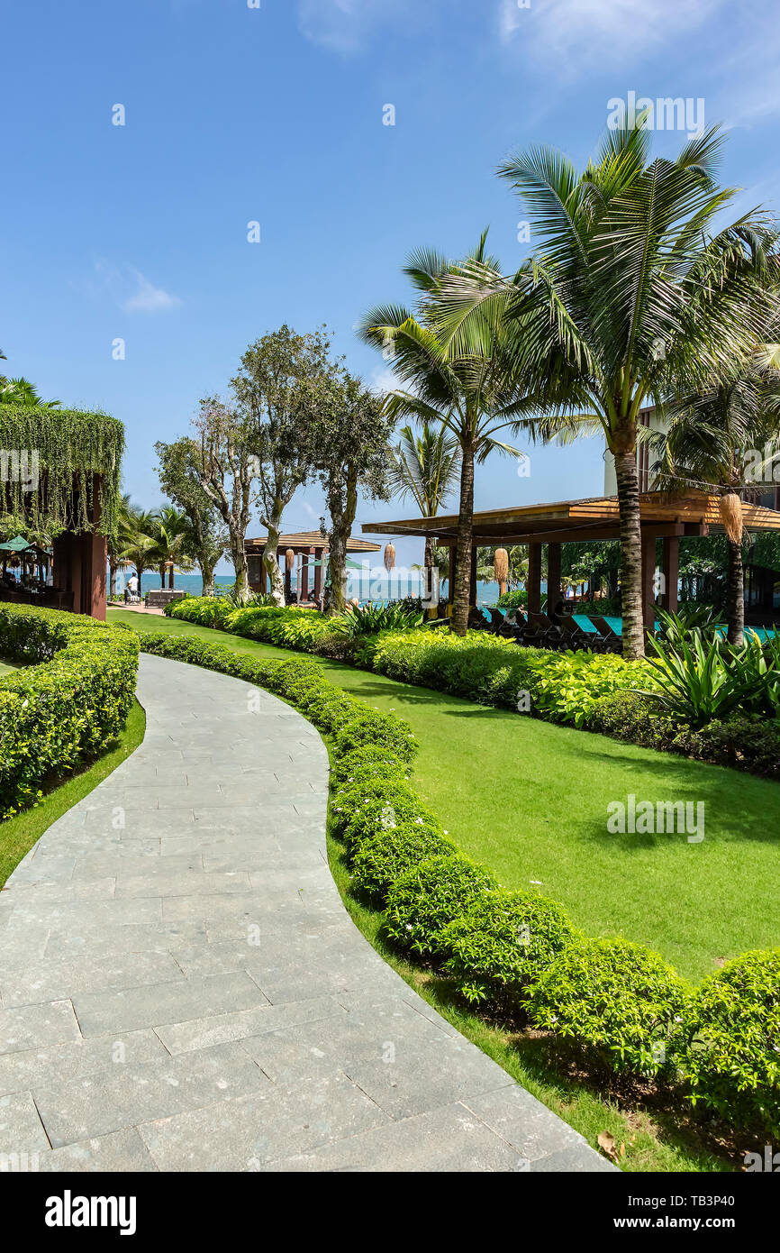 Phu Quoc, Vietnam - 19th May 2019: A curved pathway at Dusit Princess Moonrise Beach Resort Stock Photo