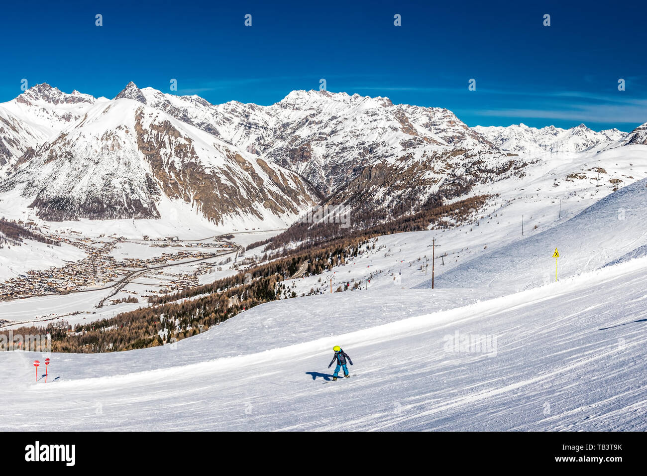 Skiers skiing in Carosello 3000 ski resort, Livigno, Italy, Europe. Stock Photo