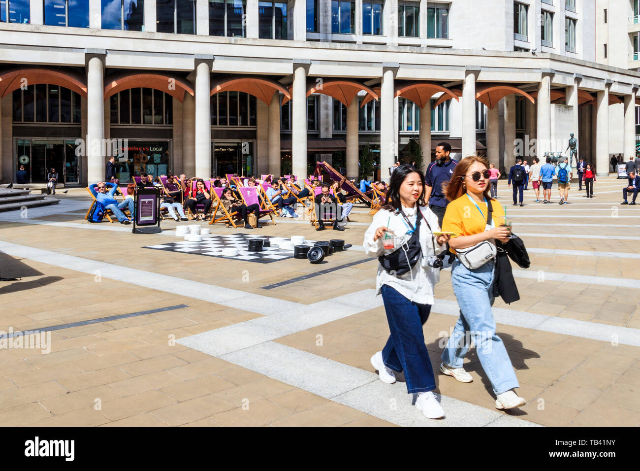 Tourists and sightseers in Paternoster Square in the City of London, UK Stock Photo