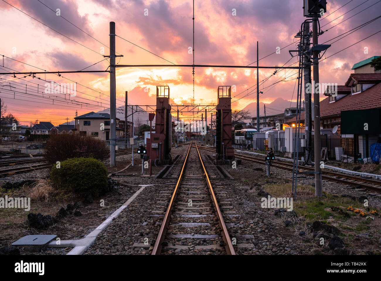 Empty Railway track near a Train Station at Sunset. Fujikawaguchiko, Japan. Stock Photo