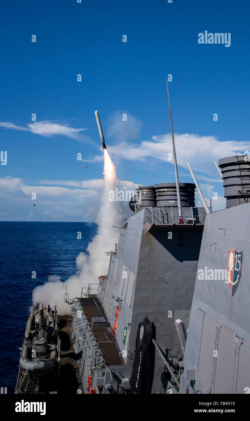 190527-N-CL550-0144 PHILIPPINE SEA (May 27, 2019) A tomahawk land attack missile is launched aboard the Arleigh Burke-class guided-missile destroyer USS Curtis Wilbur (DDG 54) during a live-fire demonstration as part of Pacific Vanguard (PACVAN). PACVAN is the first of its kind quadrilateral exercise between Australia, Japan, Republic of Korea, and U.S. Naval forces. Focused on improving the capabilities of participating countries to respond together to crisis and contingencies in the region, PACVAN prepares the participating maritime forces to operate as an integrated, capable, and potent all Stock Photo