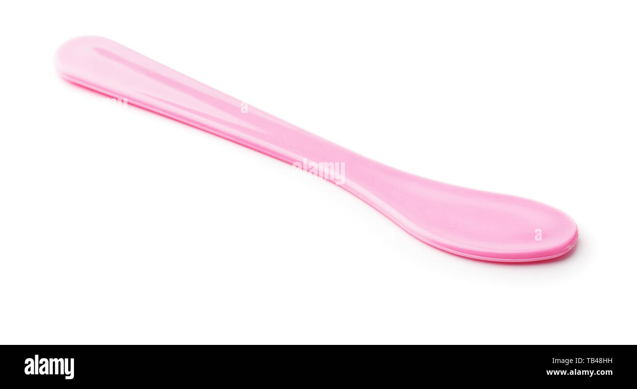 Pink plastic cosmetic spatula isolated on white Stock Photo