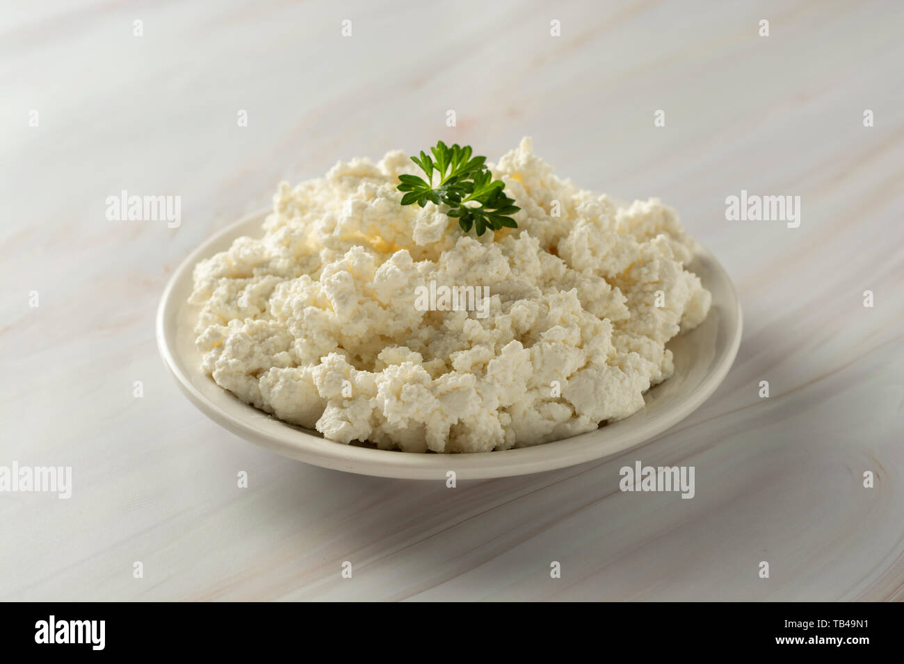 Cottage Cheese Isoalted On Light Marble Background Dairy