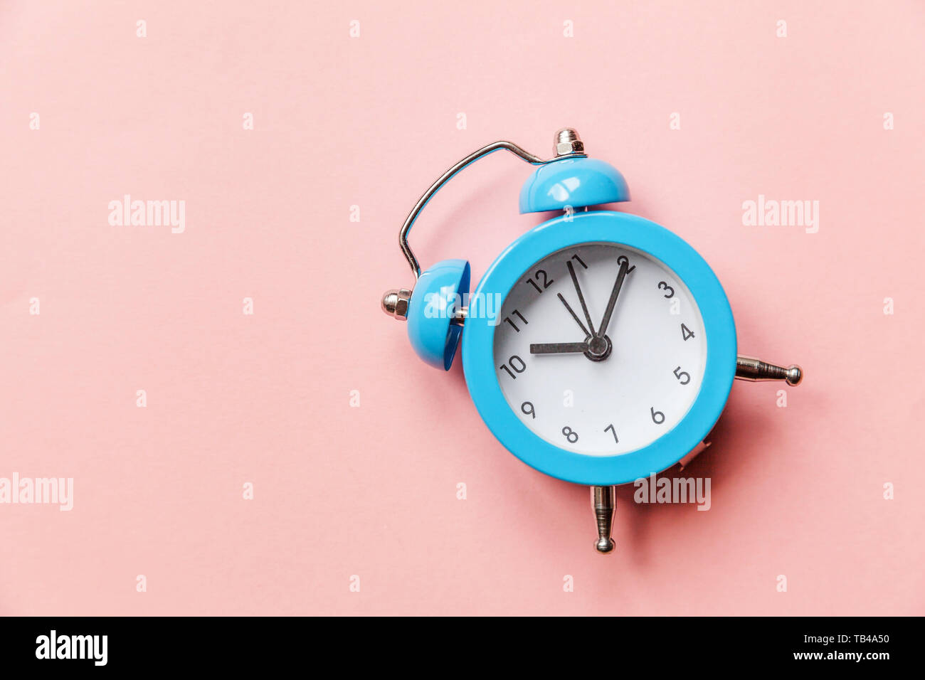 Ringing twin bell vintage classic alarm clock Isolated on pink pastel ...