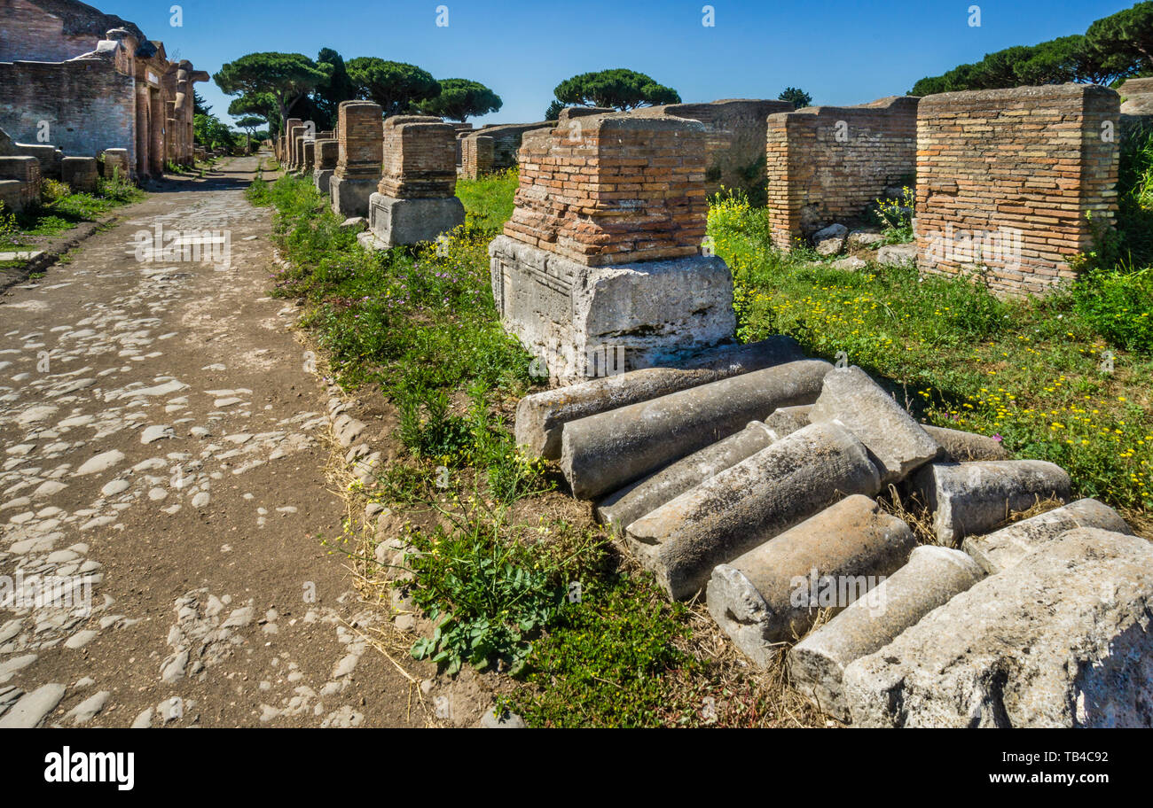 column fragments in the ruins of the archeological site of the Roman settlement of Ostia Antica, the ancient harbour of the city of Rome, Province of  Stock Photo