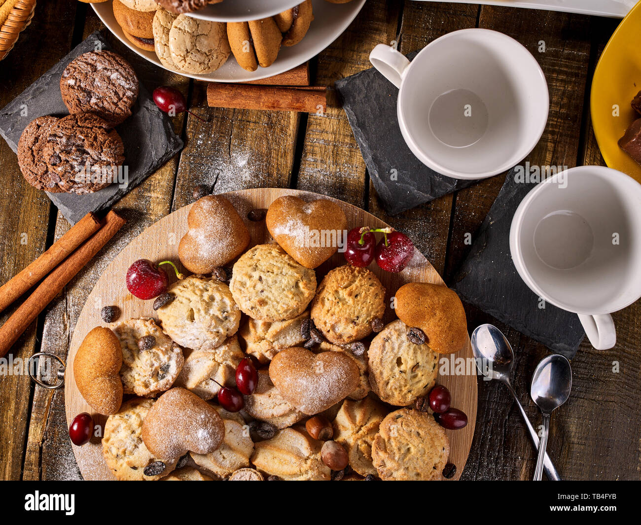 Oatmeal cookies and sand chocolate cake with cherry berry Stock Photo