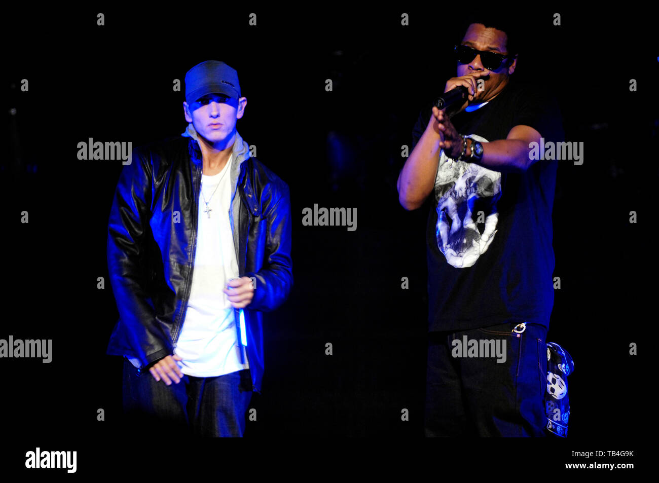 Rappers Eminem (L) and Jay-Z performs on-stage at the launch of