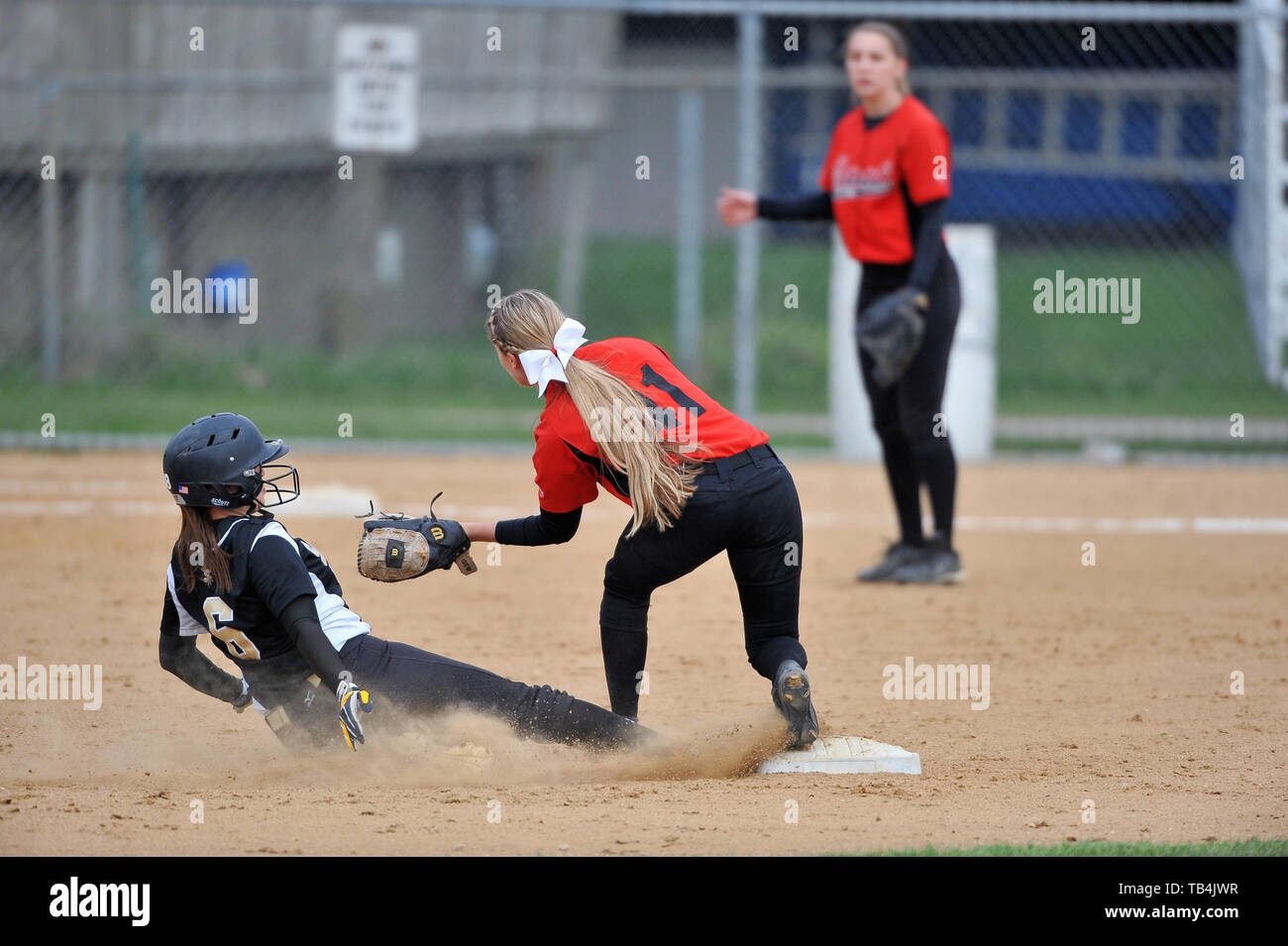 Runner being forced out at second base as opposing second baseman accepted a throw from the shortstop. USA. Stock Photo