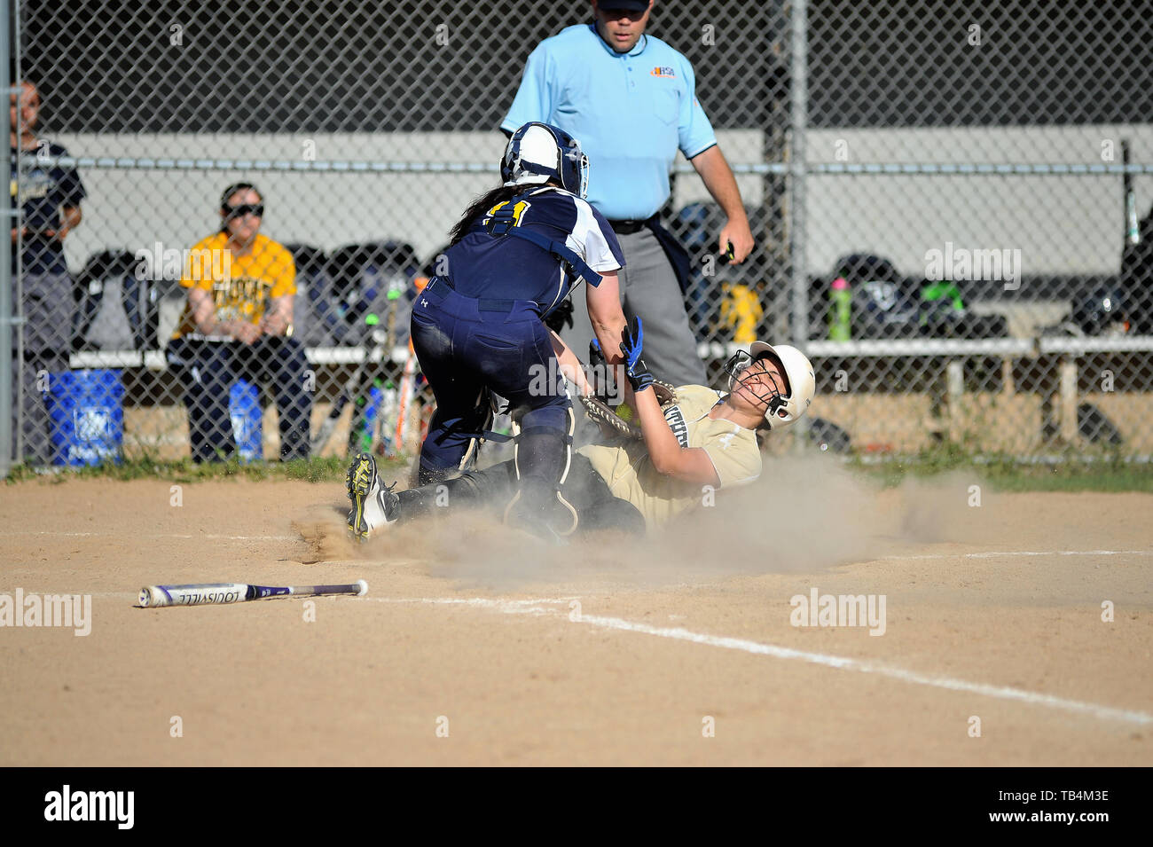 Catcher making a tag a base runner that was attempting to score. USA. Stock Photo