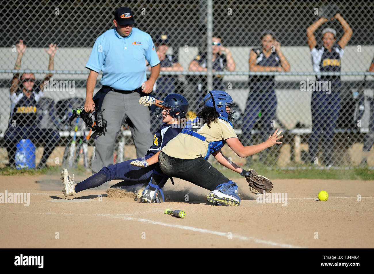 Girl softball player sliding into base hires stock photography and