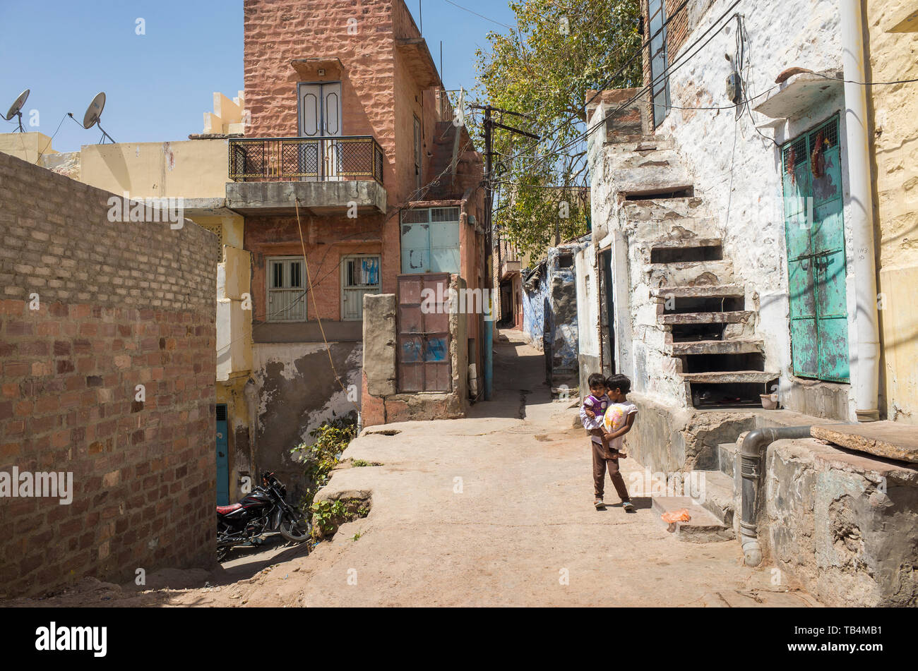 The Blue City, Jodhpur / India - 03 27 2019, Beautiful colorful buldings and architecture.Popular tourist destination in Rajasthan.Children on street. Stock Photo