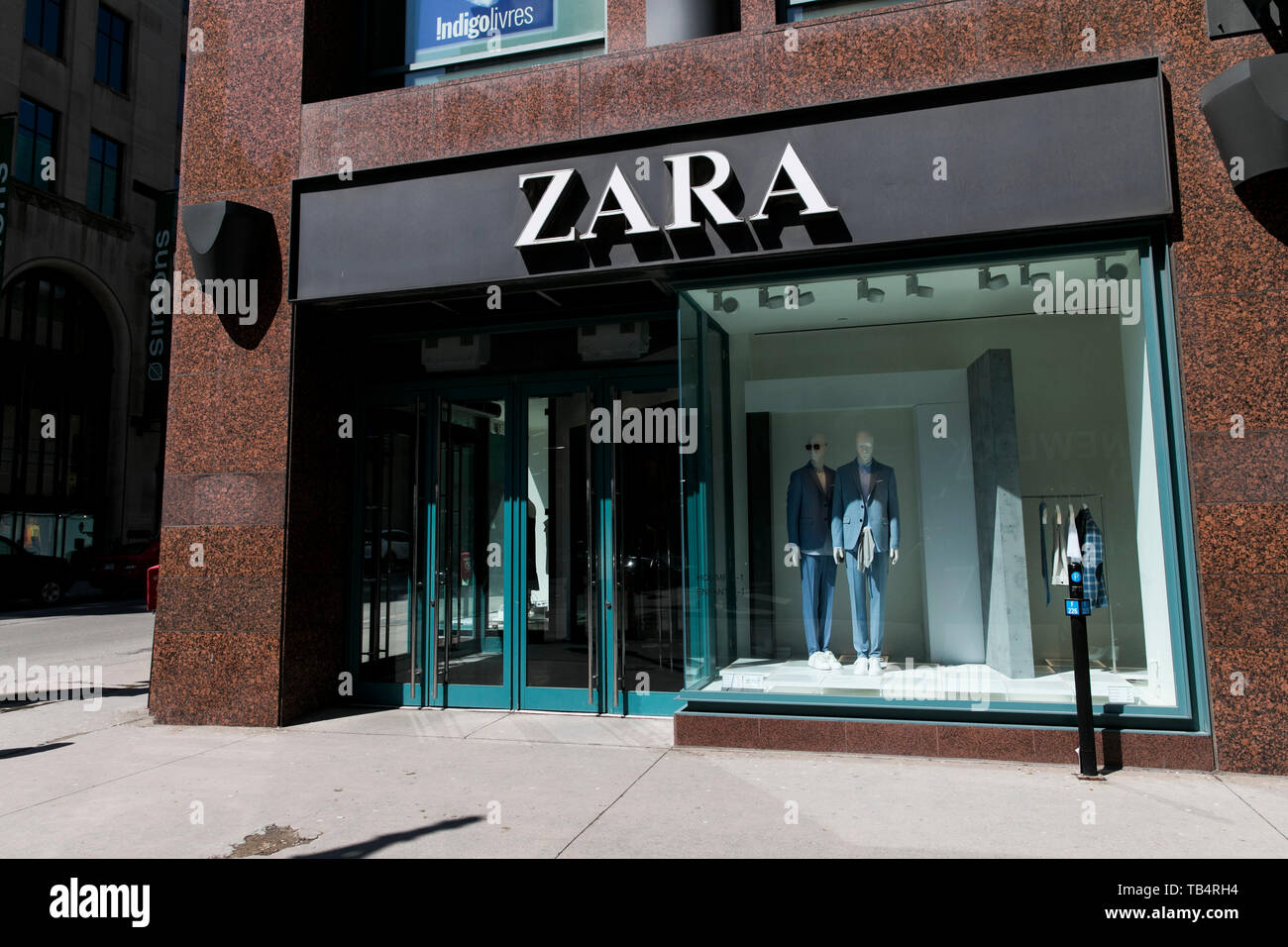 A logo sign outside of a Zara retail 