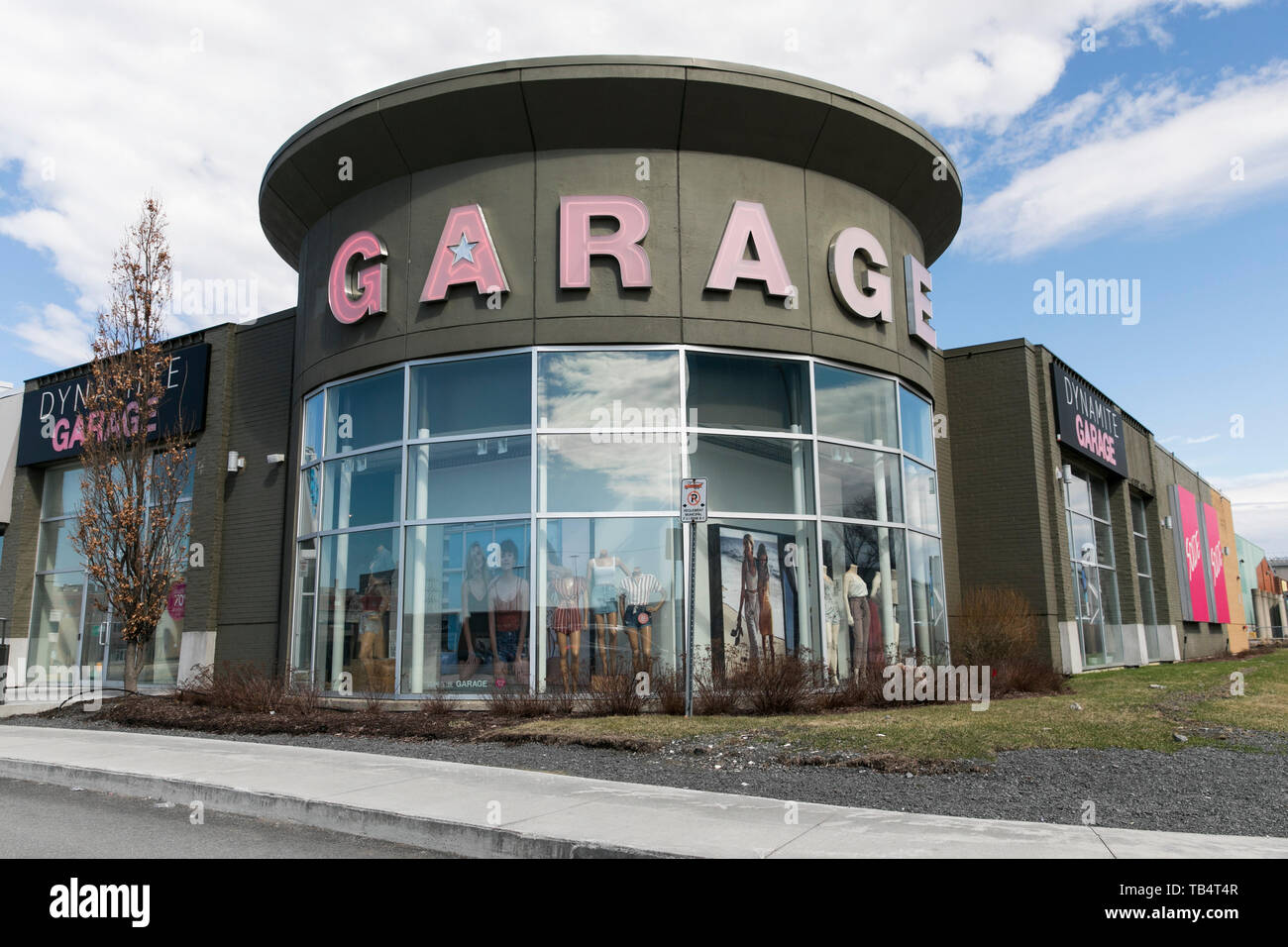 A Logo Sign Outside Of A Garage Clothing Retail Store Location In