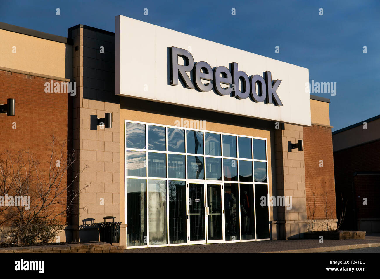 A logo sign outside of a Reebok retail store location in Boucherville,  Quebec, Canada, on April 21, 2019 Stock Photo - Alamy