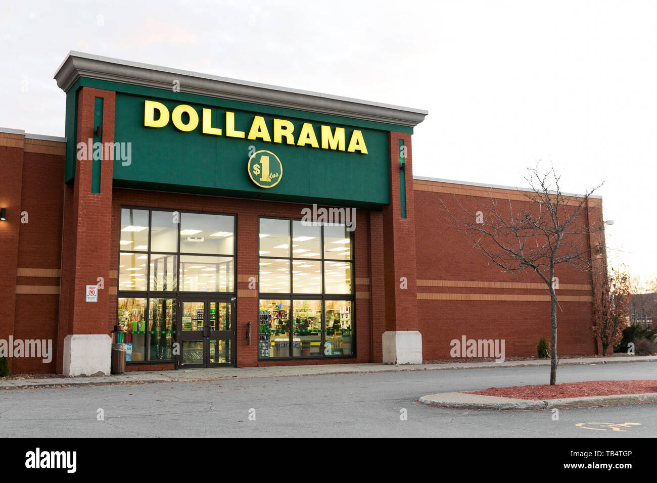 A logo sign outside of a Dollarama retail store location in SaintBruno