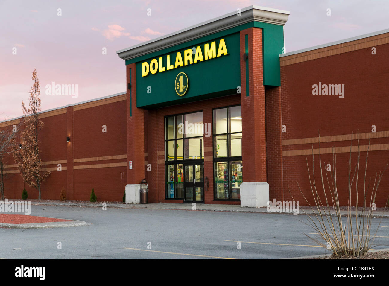 A logo sign outside of a Dollarama retail store location in SaintBruno